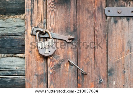 Old wooden door with metallic doorlock ストックフォト © 