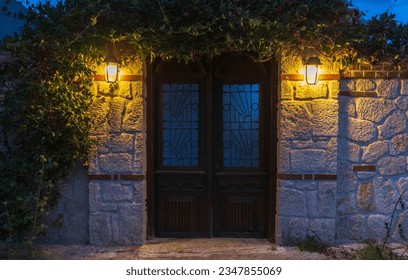 Old wooden door at night in Kassandra, Greece, Europe.
