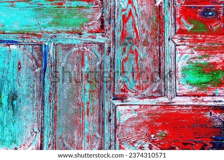 old wooden door with traces of old paint, colorful wooden background