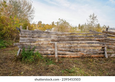 old wooden fence in the garden - Shutterstock ID 2395453503