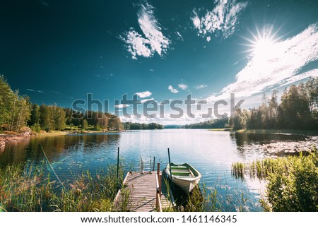 Similar – Image, Stock Photo Fishing boat moored in ocean water