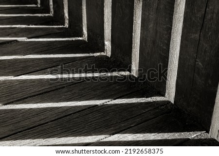 Old wooden floor. Wooden bridge with shadows and sunlights. Dark lines.