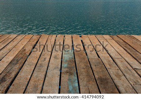 Old wooden floor and lake
