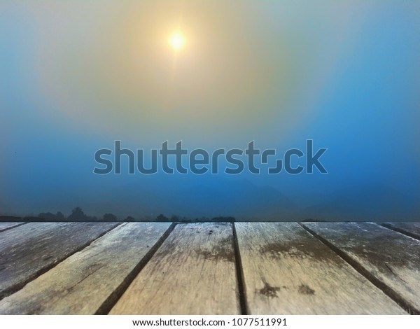 Old wooden floor with\
sky,mountain scene with beautiful moon shining, symbol of beautiful\
dream.