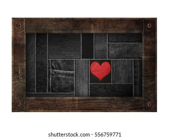 Old wooden frame with denim jean sewing pattern with red heart, isolated on white background - Powered by Shutterstock