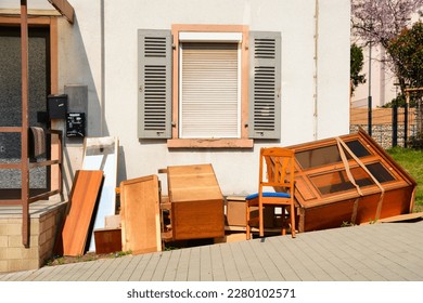 Old wooden furnitures and bulky waste in front of a house - Shutterstock ID 2280102571