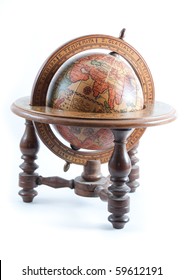 Old Wooden Globe On Wood Stand Showing Europe On Isolated White Background.