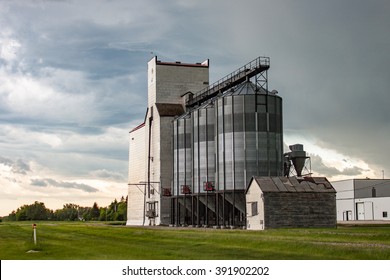 Old Wooden Grain Elevator Against Dramatic Sky