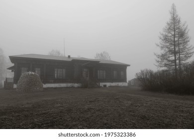 Old wooden house in the fog. Foggy morning. Beautiful rural landscape. The nature of the foggy morning. - Powered by Shutterstock