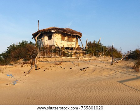 old wooden house on the sand
