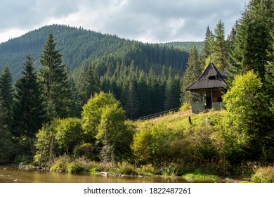 Old Wooden House On The Valley Of The River Sadu,romania