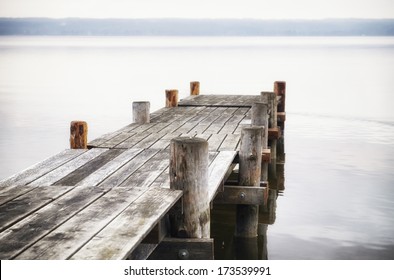 Old Wooden Jetty At A Lake