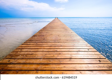 Old Wooden Jetty At A Lake