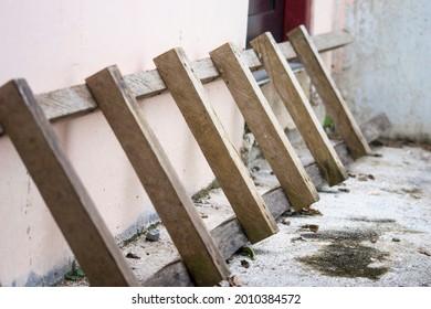 The Old Wooden Ladder Leaning Against The Wall Of The House