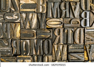 Old Wooden Letterpress Used In A Printing Press To Create Reliefs By Impressing Them Against Sheets Of Paper After Covering Them With Ink. Jumbled Anique Letters. Alphabet Background.