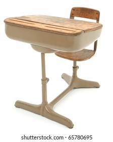 Old wooden and metal school desk over white background.