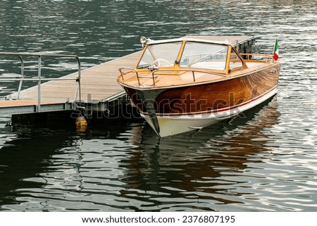 Old wooden motorboat on Lake Como in Italy