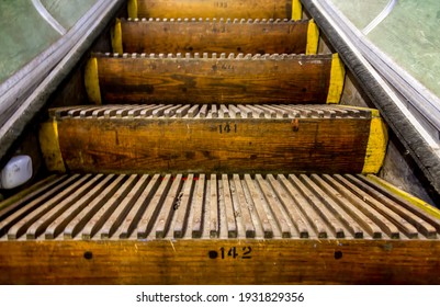 Old, wooden, numbered Escalator steps