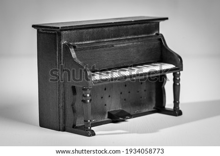 Old wooden piano from a dollhouse