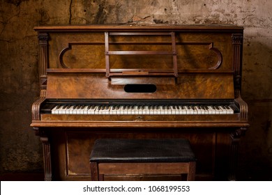 Old wooden piano keys on wooden musical instrument in front view