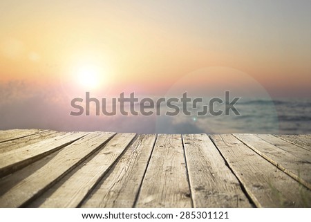 old wooden pier on the sea in  sunset