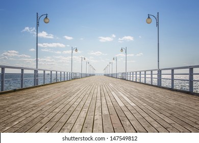 Old wooden pier over the sea shore with copy space - Powered by Shutterstock