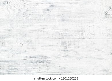 Old wooden plank texture. Shabby chic faded wood background with cracks and scratches. White & gray painted vintage board.