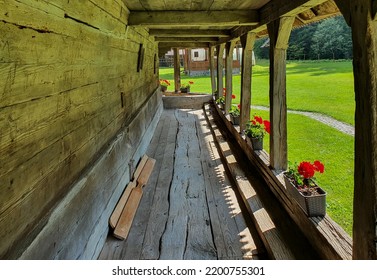 An Old Wooden Porch With Flower Pots