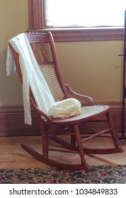 Old Wooden Rocking Chair In A Room