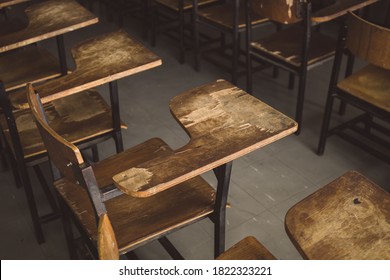 Old Wooden Row Lecture Chairs In Dirty Classroom In Poor School.study Room Without Student.concept For Education In Third World ,donate And Charity