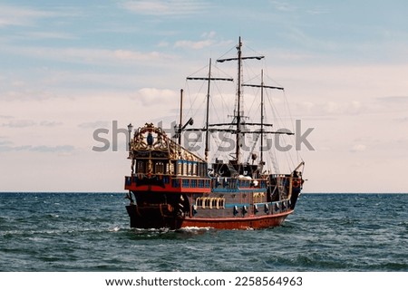 An old wooden sail ship at the sea
