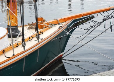 Old Wooden Sailboat Tied To Dock, Hull Of A Boat. Sailboat Bow, Docked Boat