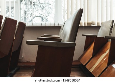 Old Wooden Seats With Reclining Seats In The Event Hall Of A Small Provincial Town