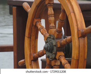 Old wooden ship rudder.  Steering wheel of an old sailing ship.