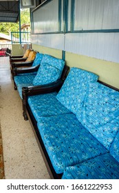 An Old Wooden Sofa With Beautiful Blue Cushion At The Living Room. Interior Design Of Traditional Malaysian Village House Concept.