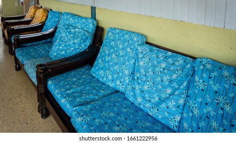 An Old Wooden Sofa With Beautiful Blue Cushion At The Living Room. Interior Design Of Traditional Malaysian Village House Concept.