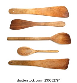 Old Wooden Spoons And Stirrers On White Background.