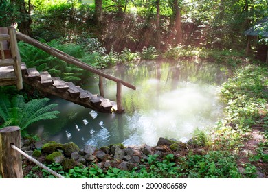 Old wooden stair to river pond near sauna in forest. Recreation and rest in beautiful places. Peaceful and harmony morning scene.