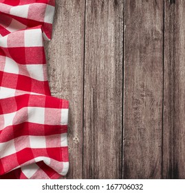 Old Wooden Table With Red Picnic Tablecloth And Copyspace