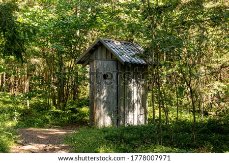 Old wooden toilet in the woods. Outhouse in the wood. ストックフォト © 