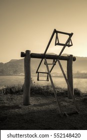 Old wooden totter in the local garden. Filter effect style