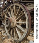 Old wooden wagon wheel on cart