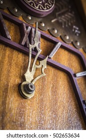 Old Wooden Wall Clock With A Cuckoo Close Up.