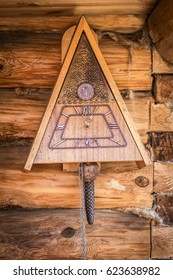 Old Wooden Wall Clock With A Cuckoo Close Up.