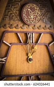 Old Wooden Wall Clock With A Cuckoo Close Up.