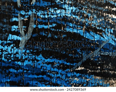 Old wooden wall, newly painted as a picture  similar to a tree with blue leaves  You can see the wood grain in the grooves.