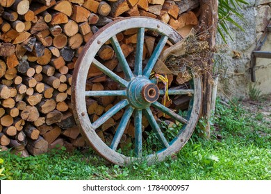 An old wooden wheel of an agricultural wagon
