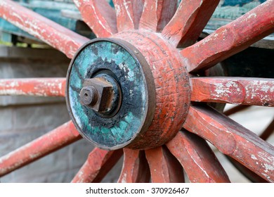 The Old Wooden Wheel On A Metal Axle