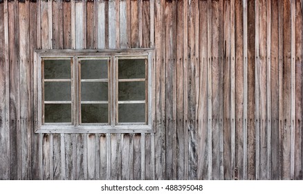 Old wooden window with grunge wood wall.