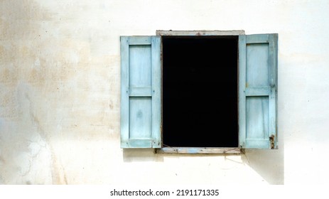 old wooden window on old wall.